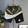 Pantalones Cortos Hombre Verano Tendencia Marca Combinación de Colores Holgados Casuales de Longitud Media Deportivos Secado Rápido Pantalones de Playa