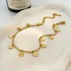 Tornozeleira Lele Jewelry de Aço Inoxidável Dourado com Pingente Redondo Pequeno, Estilo Fashion de Férias na Praia, Estilo Boho para Mulheres