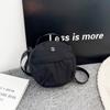2025 Otoño e Invierno Nuevo Bolso Redondo Pequeño Bolso para Teléfono Móvil Tela de Nailon Color Sólido Bolso de Hombro Cruzado Bolso Cruzado Ligero y Sencillo para Mujer