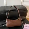 Bolso de axila estilo coreano nuevo 2026, con un diseño relajado, de color liso y minimalista, un bolso cuadrado pequeño moderno y único que se puede llevar como bolso de hombro o bolso cruzado