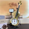 Reloj despertador de simulación de violín al por mayor directo de fábrica, reloj de escritorio creativo con forma de instrumento musical, decoración de sala de estar, reloj de mesa