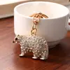 Llavero creativo de oso polar con diamantes, lindo colgante de animal con pedrería, charm para bolso de mujer, llavero de coche