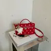 Bolsa pequena estilo explosivo popular deste ano para mulheres 2026 nova moda retrô bolsa quadrada pequena de mão bolsa transversal versátil