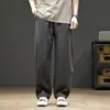 Pantalones casuales de color liso para hombre, nuevos pantalones de marca rectos versátiles y modernos de verano 2026, pantalones curvos modernos