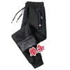 Venta al por mayor de fábrica pantalones largos de invierno gruesos con forro polar de terciopelo no invertido pantalones casuales pantalones de chándal para hombre pantalones deportivos para hombre con tobillo fruncido