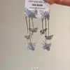 Super Fada Caindo Sentido Borboleta Borla Orelha Clipe Longo Elegante Estilo Frio Luz Luxo High-end Sense Novos Brincos