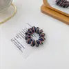 El scrunchie de cordón de teléfono trenzado de color contrastante de la celebridad de internet coreana Morandi es simple, muy elástico y duradero.
