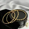 Pulsera de trenza retorcida de anillo fino de acero de titanio con hilo de aguja caliente cruzada para mujer Joyería de mano dorada para apilar anillo liso de lujo ligero No se decolora