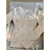 Camiseta Amarilla Leche Manga Larga Diseño Femenino Camisa Base Top de Hombro de Conejo Ropa Nueva Primavera y Otoño 2025