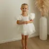 Vestido Blanco de Princesa con Mangas Abullonadas 2026 Verano Color Sólido Vestido Abullonado para Niños Pequeños Dulce y Lindo Vestido Infantil Venta al por Mayor