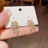 2025 Explosiones Coreanas Microincrustadas Zircón Flor Borla Aretes Mujer Nicho Alta Gama Lujo Ligero Personalizado Aretes de Moda