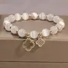 Pulsera de piedra de ojo de gato para mujer, brazalete de cristal de trébol de cuatro hojas, cuerda elástica, cuentas de transferencia de perlas, cuerda de mano al por mayor, novedad de 2024