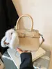 Bolso de Mano Pequeño de Alta Gama Estilo Coreano para Mujer 2026 Nuevo Modelo Bolso de Hombro Retro Sencillo para el Trabajo y los Viajes Diarios Bolso Cruzado de Moda