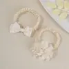 Diadema elástica suave transfronteriza europea y americana para bebé, accesorio para el cabello de banda delgada transpirable con flor de lazo para bebé