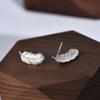 Pendientes de plata S999 para mujer, diseño simple de nicho, estilo frío, piercing en la oreja, pluma, creativos, moda, joyería para la oreja
