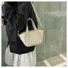 Bolso tejido de color sólido de nicho transfronterizo para mujer, nuevo modelo de moda 2026, versátil bolso de hombro y cruzado