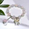 Pulsera de Puesto al por Mayor de 1 Yuan Imitación Piedra Ojo de Gato Marca Bendición Cuentas de Flor de Durazno Nicho de Alta Gama Flor Lirio de los Valles Mariposa Pulsera