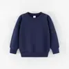 Suéter de color liso para niños, primavera y otoño, manga larga, ropa para niños, camisa blanca lisa, fabricantes de ropa para jardín de infantes, logo estampado en el lugar