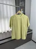 Nuevo top de verano para hombre de moda, color amarillo verdoso claro, manga corta raglán, con costuras curvas de contraste, corte holgado, cuello redondo, casual y versátil