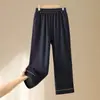 Pantalones rectos de mezclilla suave para madres, pantalones versátiles, nuevo estilo otoño e invierno 2026, pantalones para mujeres de mediana edad mayores de 50 años, pantalones largos de cintura elástica para mujeres