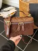 Bolsa Caixa de Camurça Cor Sólida Nova Outono 2025 Fashionável Simples Corrente High-End Xadrez Ombro Único Transversal Feminina