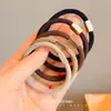 Tubo cuadrado de sarga cuerda para el pelo color marrón leche banda de goma simple de alta elasticidad banda básica para el pelo cuerda para el pelo en bola accesorios para el pelo al por mayor