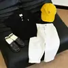 Pantalones casuales versátiles para niños estilo coreano, nuevos para el verano 2026, negros, bordados, de manga corta, tejido fino, estilo moderno