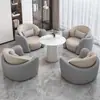 Conjunto minimalista y lujoso de sofá individual y mesa de centro, adecuado para uso casual en hoteles, salones de belleza, áreas de recepción y centros de exposiciones; también incluye un juego de mesas y sillas para reuniones y discusiones