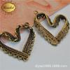 Colgante de joyería DIY con forma de corazón hueco europeo y americano directo de fábrica de Yiwu al por mayor