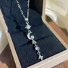 Producto nuevo transfronterizo, un artículo popular en el Sudeste Asiático: un collar largo de acero de titanio con tema de estrella, luna y sol, con borlas, una pieza de joyería de moda y completamente adornada para mujeres
