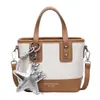 Bolsa feminina de nicho 2026 nova tendência primavera alto valor para o dia a dia transversal balde bolsa de ombro casual