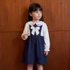 Vestidos para niñas transfronterizos, nueva colección otoño/invierno 2026, estilo europeo y americano, vestidos con cuello de muñeca para niños pequeños, vestidos de manga larga para niños, al por mayor