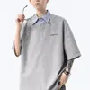 Camisa polo de retazos a rayas con solapa, diseño único de dos piezas falsas para hombre, de manga corta, de verano, moderna, corte holgado
