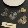 Pendientes Minimalistas de Borla de Pétalo Nicho Versátiles Pendientes de Gama Alta Moda de Lujo Ligero Pendientes de Personalidad Venta al por Mayor