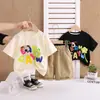 Verão 2025 Novo Desenho Animado Bebê Casual Tendência Manga Curta Conjunto de Shorts para Meninos e Meninas Duas Peças Tendência Atacado Dropshipping