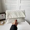 Bolso de lunares para mujer, nueva colección de otoño 2026, súper moderno, exquisito, versátil bolso pequeño cuadrado estilo sobre, adecuado para ir al trabajo y eventos nocturnos