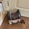 Bolsa de ombro Shuai Mi Jia nicho retrô texturizada 2026 verão nova simples bolsa baguette corrente de ombro pequena quadrada