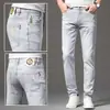 Temporada de primavera y otoño, pantalones de mezclilla grises para hombre, elásticos, modernos, corte ajustado, pierna cónica, estilo europeo, con estampados únicos, pantalones largos casuales