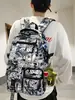 Mochila Escolar 2026 Novo Estilo Mochila com Grafite de Desenho Animado para Meninos do Ensino Fundamental, Mochila de Nylon Tendência de Grande Capacidade