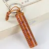 Colgantes de llavero para coche de madera de durazno al por mayor para fabricantes con escrituras budistas, el Mantra Shurangama, sutras auspiciosos y amuletos de la fortuna, disponibles para vendedores ambulantes