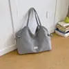 Bolsa feminina de grande capacidade com um toque descontraído Verão 2026 Nova Casual Alta Aparência Para o Trabalho Bolsa de Ombro Única Bolsa de Tecido Leve