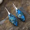 Nuevos pendientes colgantes de hojas de piedra natural bohemios europeos y americanos de moda, joyería retro de estación independiente transfronteriza.