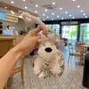 Falda Creativa de Cuero Plateado Perro Oeste de Peluche Muñeco Llavero para Coche Dibujo Animado Muñeco Cachorro Creativo Adornos para Colgar en Bolsos para Mujeres