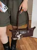 Bolsa baguette de camurça vintage de alta qualidade para mulheres, nova bolsa de ombro/axila de moda de nicho 2026, bolsa de mão para o dia a dia