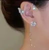 TikTok Venta Caliente Mismo Estilo Colgante de Oreja Flor de Borla Giratoria Colgante de Oreja Mariposa Duende Pendientes Accesorios de Oreja Lujo Ligero sin Agujeros en las Orejas