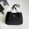 Bolso de mujer 2026 otoño nuevo estilo coreano mochila escolar para estudiante bolso de hombro simple y moderno bolso tote de gran capacidad para ir al trabajo
