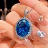 Nuevo 2025 Zhuangshengsheng Joyería Base de Cobre Chapado en Oro Espinela Azul Imitación Juego de Joyería de Alta Gama Piedra para Mujer 15*20