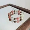 Pulsera RedwoodNatural Flor de Resina Roja Oro Negro Super Siete con Sándalo Dorado y Cristal de Limón, Única y Versátil