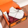 Bolso de Mujer Nuevo de Gama Alta Plegado Nubes Bolso de Axila Piel Genuina Cadena de Bolas Doradas Capa Superior Piel de Vaca Bolso de Hombro Cruzado