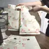 Sacola de loja de roupas Sacola plástica Bolsa pequena Bolsa de compras de joias Sacola de embalagem de presente Cosméticos Sacola de quatro dedos espessada